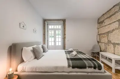 a sink with a faucet and a bottle of soap at GuestReady - Grandeur River Balcony Reborn in Porto