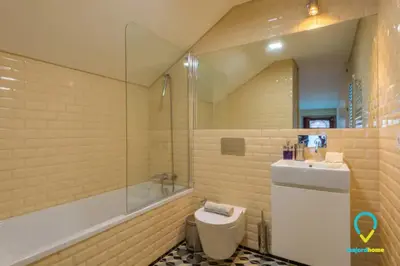 a bathroom with a toilet and a sink and a tub at Pretty Porto in Porto