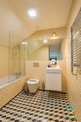 a bathroom with a tub and a toilet and a sink at Pretty Porto in Porto