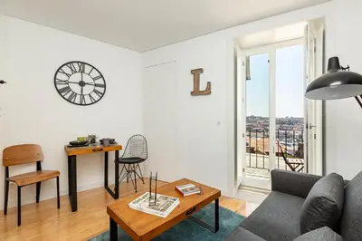 a living room with a couch and a table at Virtudes River Views by Porto City Hosts in Porto