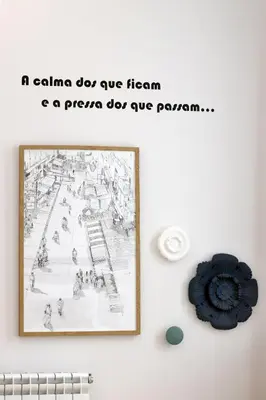 a picture on a wall with a picture of a roller coaster at HM - Vagus Oporto House in Porto