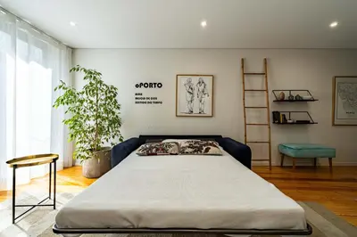 a bedroom with a large bed in a room at HM - Vagus Oporto House in Porto