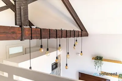 a chandelier hanging from a ceiling in a room at Flores - Delight Loft Porto - Next to Ribeira in Porto