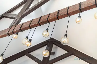 a cluster of lights hanging from a ceiling at Flores - Delight Loft Porto - Next to Ribeira in Porto
