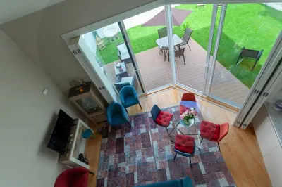 an overhead view of a living room with a table and chairs at Oporto City View - Flora Garden in Porto