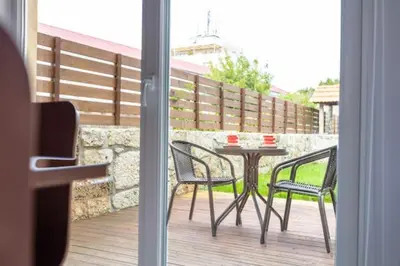 a patio with a table and chairs on a balcony at TMH Torrinha in Porto