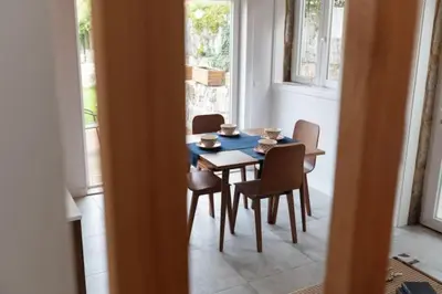 a dining room with a table and chairs in a room at TMH Torrinha in Porto