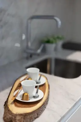 a wooden tray with two cups on a kitchen counter at Swimming Pool Luxury House 1 in Porto