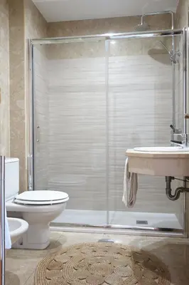 a bathroom with a shower and a toilet and a sink at Porto River Sunset 7th in Vila Nova de Gaia