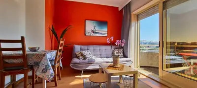 a living room with a couch and a table at Porto River Sunset 7th in Vila Nova de Gaia