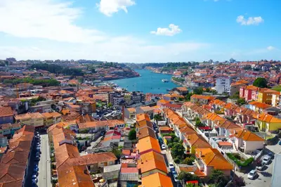 an aerial view of a city with a river at Porto River Sunset 7th in Vila Nova de Gaia
