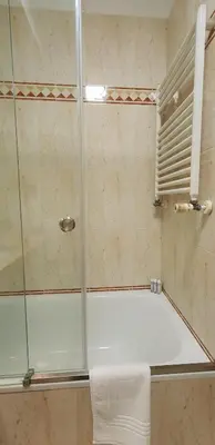 a shower with a glass door in a bathroom at VIVER D'AMOR Oporto Douro River Flat in Vila Nova de Gaia