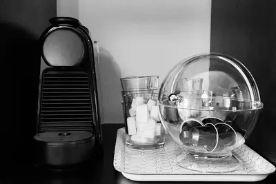 a glass bowl sitting on a table with a blender at VIVER D'AMOR Oporto Douro River Flat in Vila Nova de Gaia