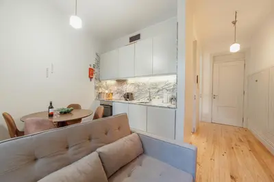 a living room with a couch and a table at Cozy Flat with Terrace by Hosty in Porto