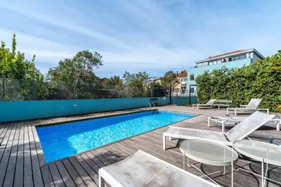 an image of a swimming pool on a deck with chairs and a swimming pool at HM - Segredo do Porto in Porto