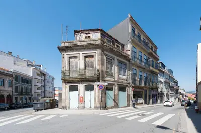 an old building on the corner of a city street at Rua do Freixo in Porto
