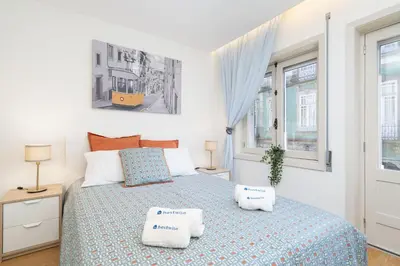 a bedroom with a bed with two pillows on it at Host Wise - Colorful Bright Flat with Balcony in Porto