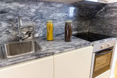 a bathroom with a shower with a tub at Guest H4U - Porto Fontainhas in Porto