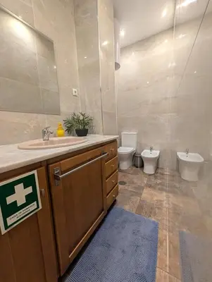 a bathroom with a toilet and a sink and a toilet istg at Beautiful Infante Apartment in Porto