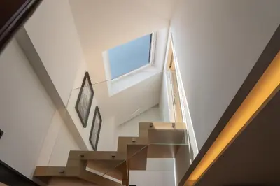 a staircase in a house with a window at Decor Studios - Clérigos by Host Wise in Porto