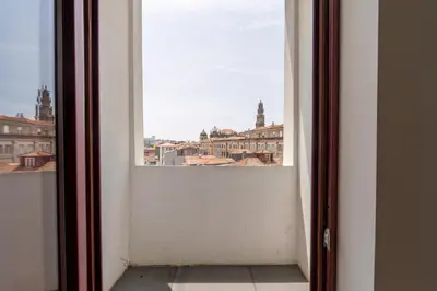 an open door with a view of a city at Decor Studios - Clérigos by Host Wise in Porto