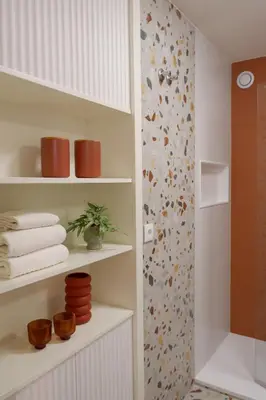 a bathroom with a shower and a shelf with towels at Porto Family Home by MP - Renovated in Porto