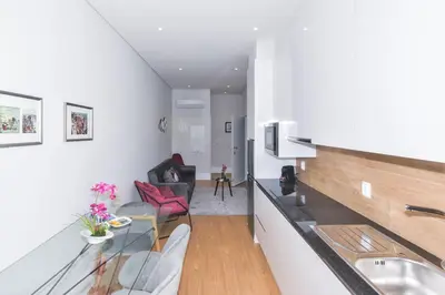 a small apartment with a kitchen and a living room at Fontinha Square Apartments by Porto City Hosts in Porto
