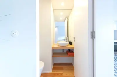 a bathroom with a sink and a mirror at Duplex Douro River in Porto