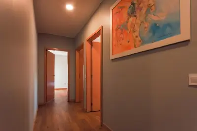 a hallway with a painting on the wall at Porto Cathedral II in Porto