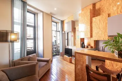a living room with a couch and a table at 118 Oporto Apartments in Porto