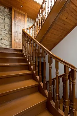 a staircase with wooden railings and a wooden door at Charming Ribeira Apartment 328 feet Douro River Unesco in Porto