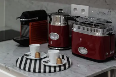 a kitchen counter with two coffee cups and a toaster at Swimming Pool Luxury House 2 in Porto