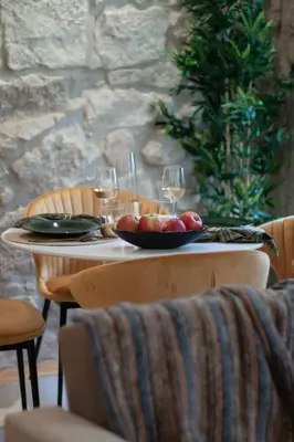 a table with a bowl of fruit and wine glasses at Swimming Pool Luxury House 2 in Porto