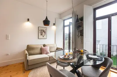 a living room with a table and a couch at Sunset Flat Santa Catarina in Porto