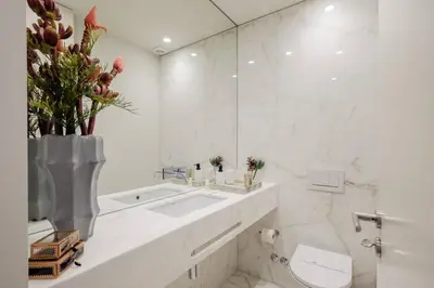 a bathroom with a sink and a toilet and a mirror at BOUTIQUE Rentals- Art & Charm Apt w/ balcony & garage in Porto