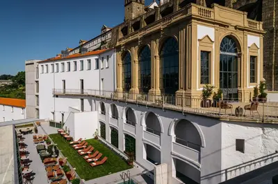 an external view of a building with a balcony at Vincci Ponte de Ferro in Vila Nova de Gaia