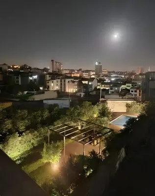 a view of a city at night at Porto Pool Spot in Porto