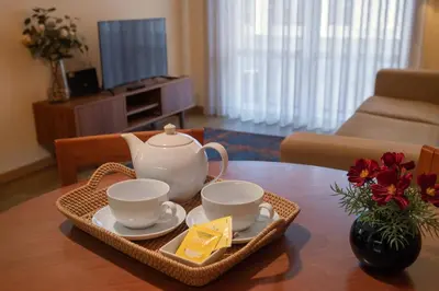 a tea set on a table in a living room at Bolhão Apartment in Porto