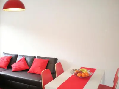a living room with a couch and a table with a bowl of fruit at O´Porto Torrinha Flat in Porto