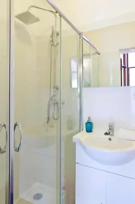a bathroom with a sink and a shower at O´Porto Torrinha Flat in Porto