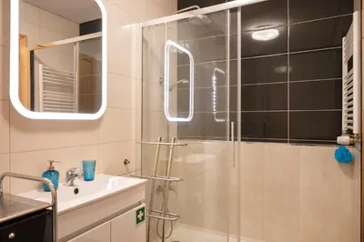 a bathroom with a shower and a sink at O´Porto Fontainhas Flat in Porto