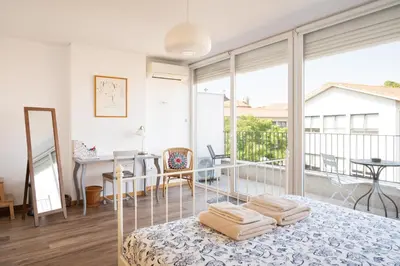 a bedroom with a bed with towels on it at O´Porto Fontainhas Flat in Porto