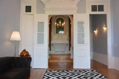 a living room with a couch and a fireplace at Bonjardim 466 - Historic Townhouse in Porto