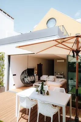 a man standing in a kitchen preparing food at Oporto Diamond Luxe & Terrace in Porto