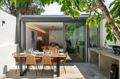 a dining room with a table and chairs at Villa Almada - Amazing City Centre Villa with Private Pool in Porto