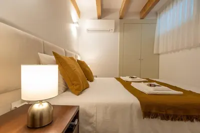 a bedroom with a bed with a lamp on it at CC Downtown Palace - B in Porto
