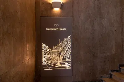 a sign with a picture of a bridge on a wall at CC Downtown Palace - D in Porto