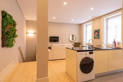 a kitchen and living room with a washing machine at CC Downtown Palace - D in Porto