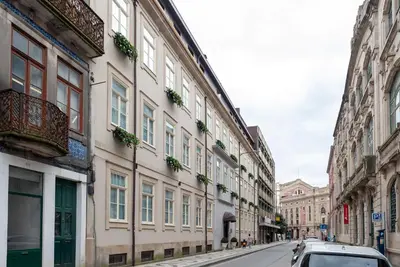 a car parked on a street next to buildings at CC Downtown Palace - D in Porto