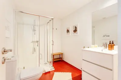 a white bathroom with a shower and a toilet at DA'HOME - Boavista Blue Studio - NEW in Porto